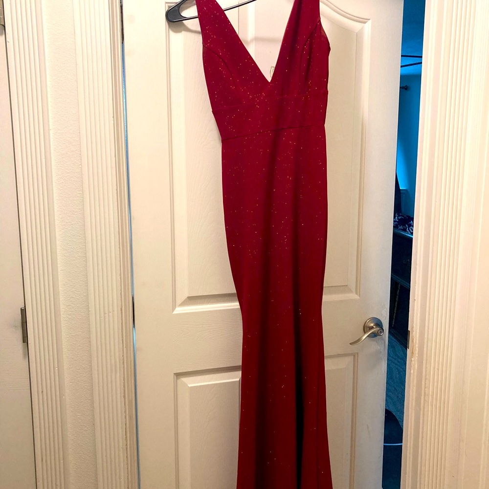 Sparkly red mermaid dress with deep v neck.